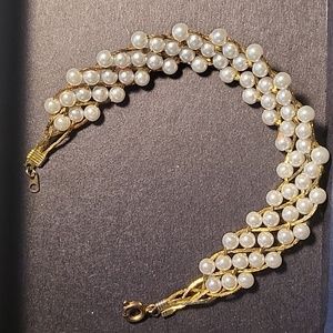 Pearl with gold bracelet.